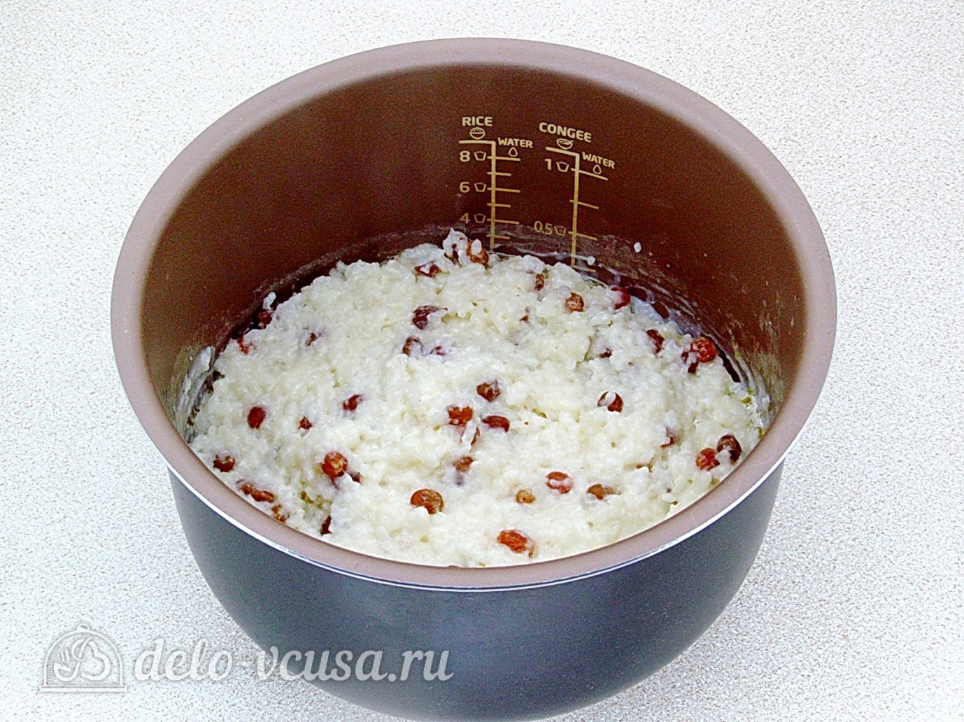 Шаг 5 приготовления Рисовая каша на молоке с изюмом