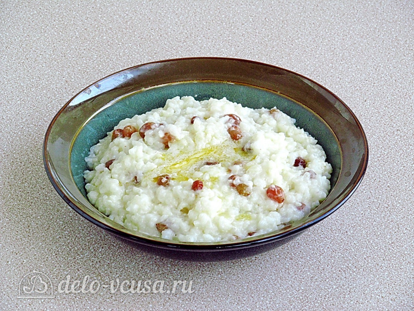 Шаг 6 приготовления Рисовая каша на молоке с изюмом