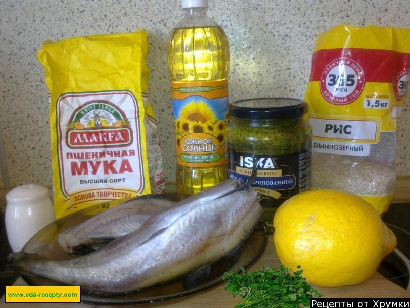 Шаг 1 приготовления Минтай жареный с рисом и с соленными огурцами